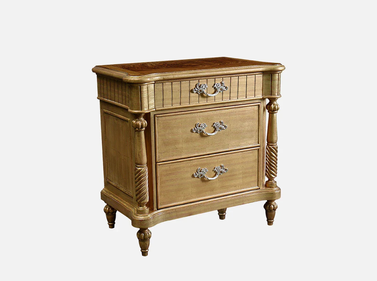 Side view of French style gold nightstand with luxury carved details