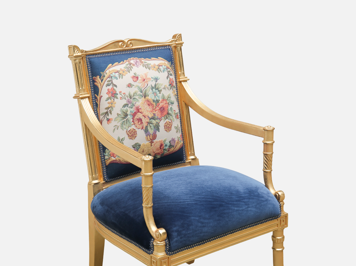 Close-up of AC-404 navy armchair — beech wood carved gold leaf details, jacquard floral panel, and navy velvet upholstery