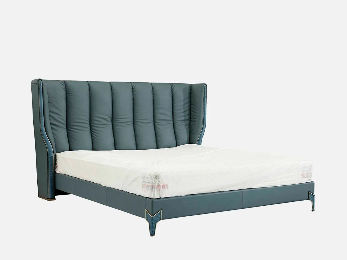 Angle view of MB-2930 luxury bed with leather showcasing brass-plated 304 stainless steel details for modern luxury bedroom interiors