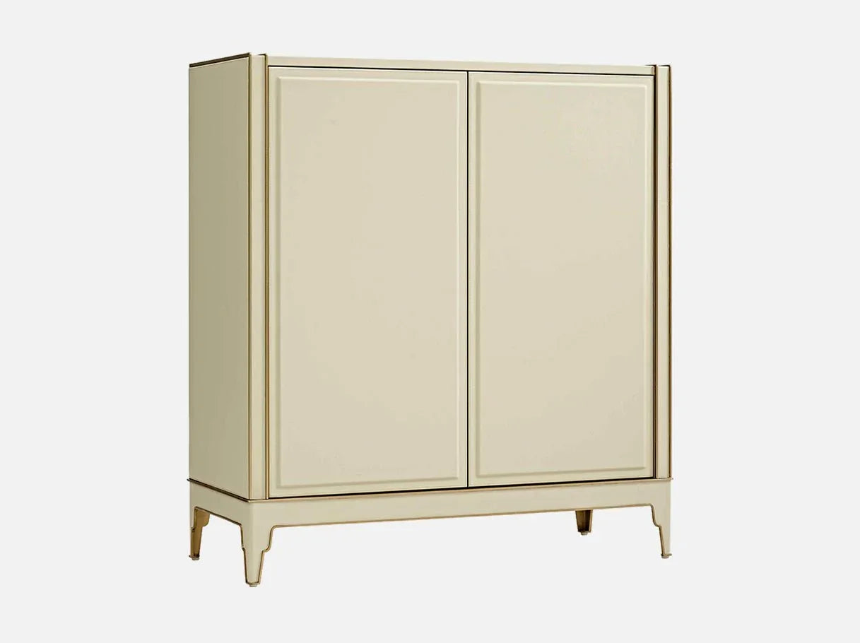 Angle view of MX-2781 chest of drawers showcasing its custom modern silhouette, faux leather & brass-accented steel construction