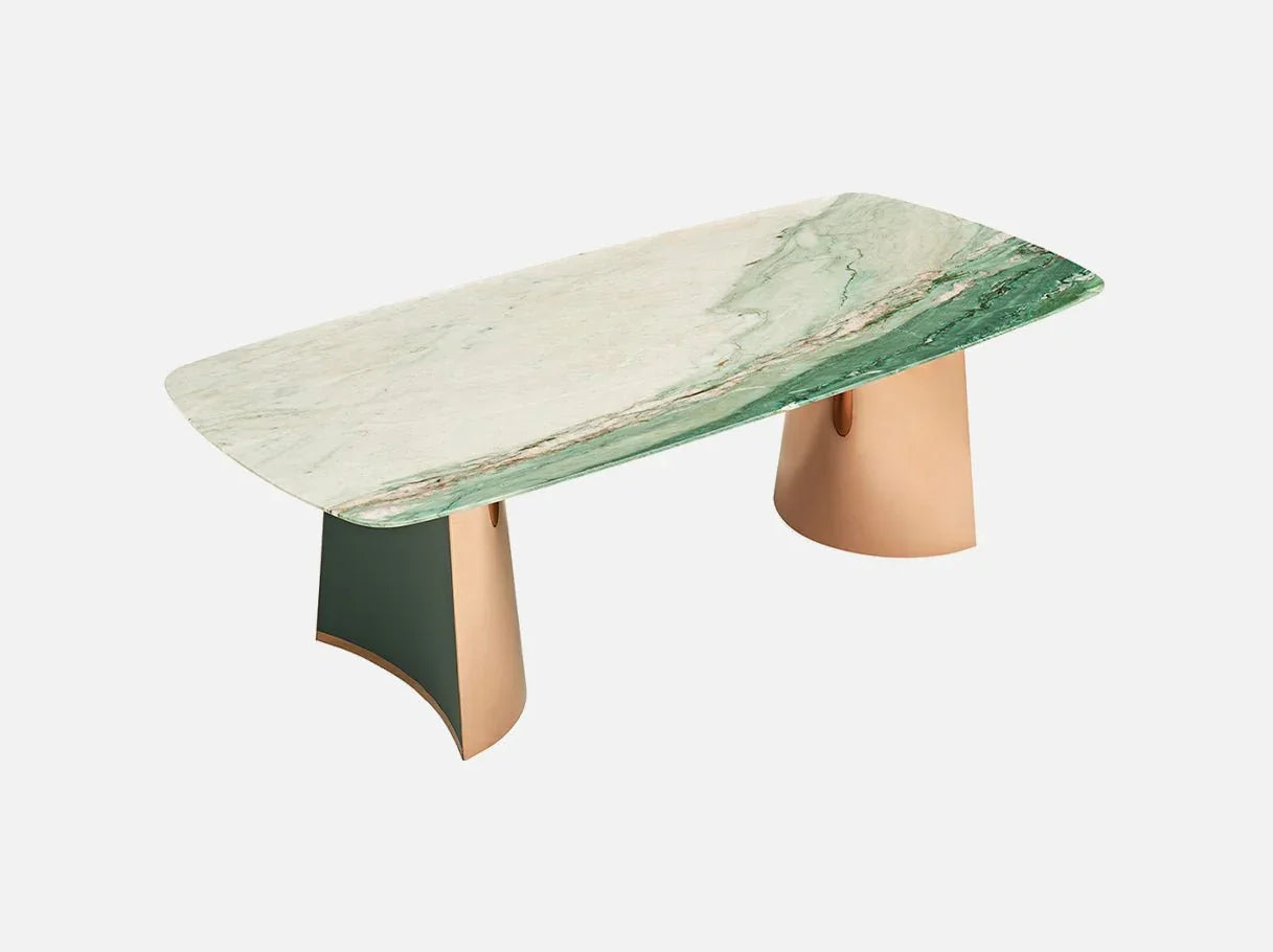 Angle view of MD-2887 large dining room table showcasing Royal Green marble’s deep green hues, dynamic veining, and sculptural brass accents