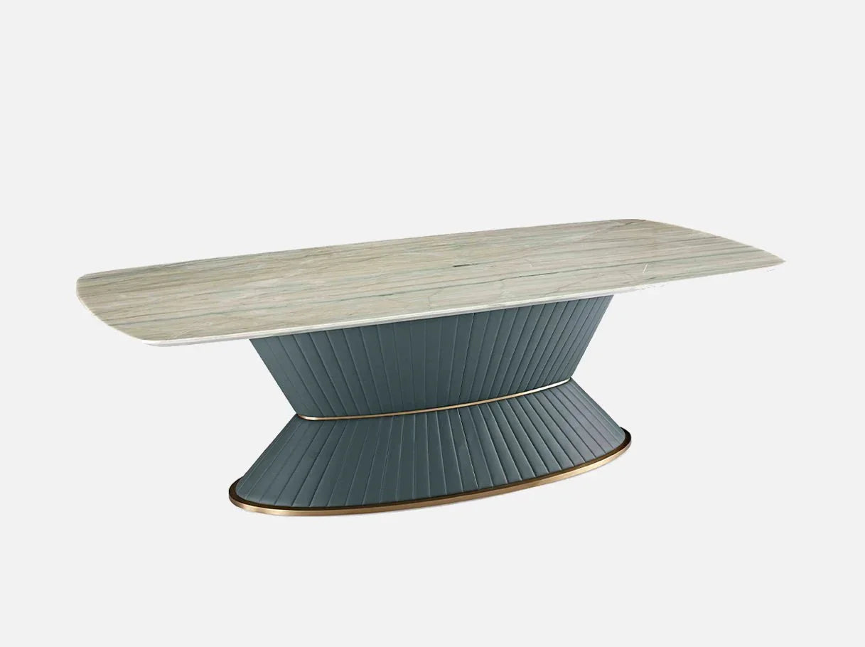 Angle view of MD-5001 long dining room table showcasing Royal Green marble’s veining, tech leather’s ribbed texture, and brass-plated details