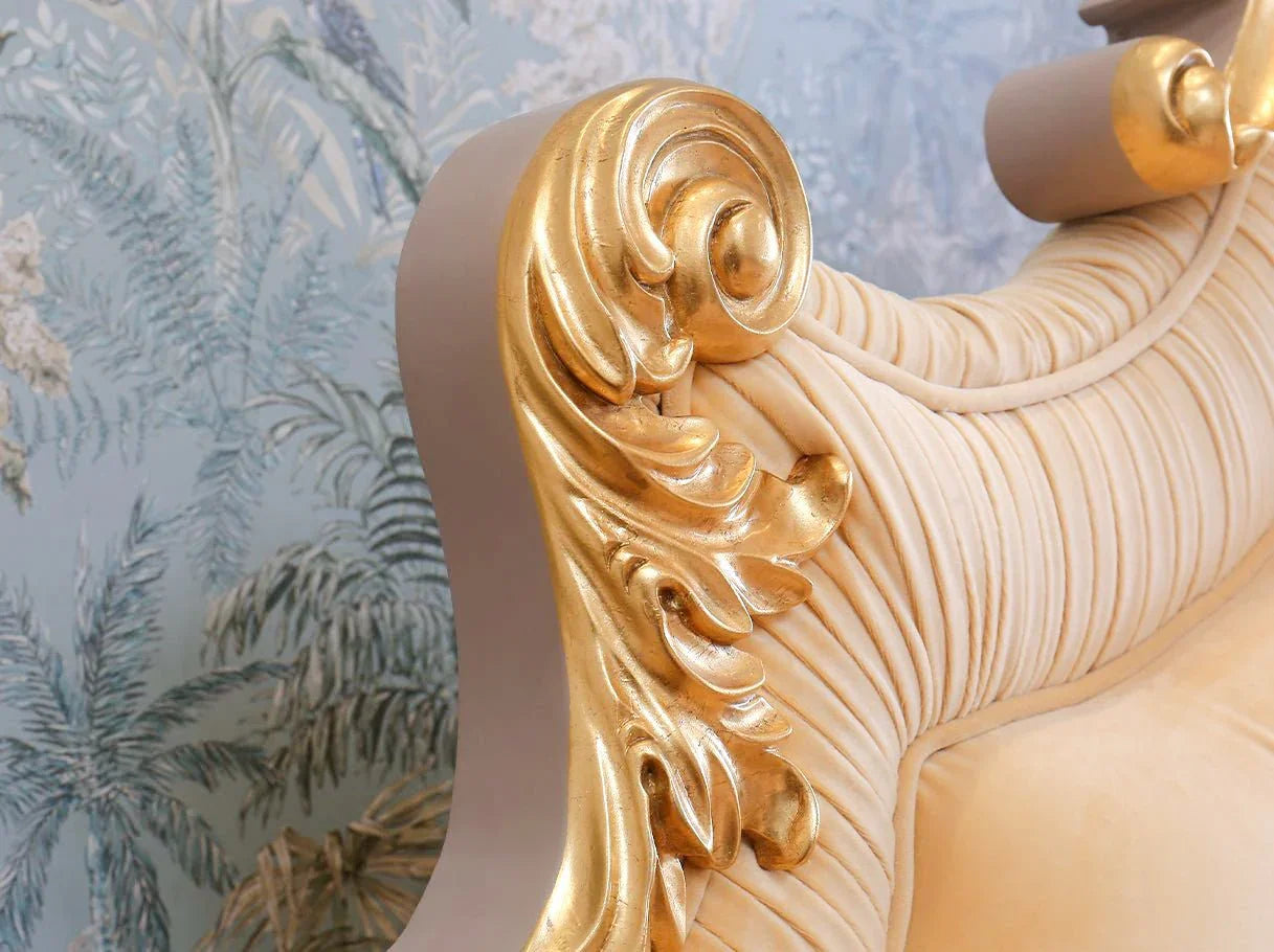 Detail of gold bed B-042 carved crest with gilded beechwood finish and classical design.