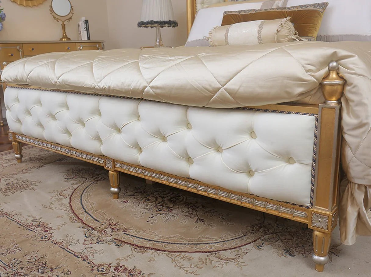 Tufted footboard of French bed B-072 upholstered in velvet and framed with carved beechwood.