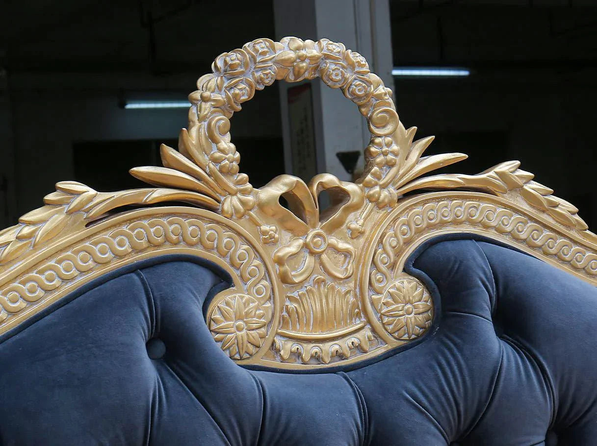 Crown detail of French bed B-077 with carved wood and gold leaf finish.