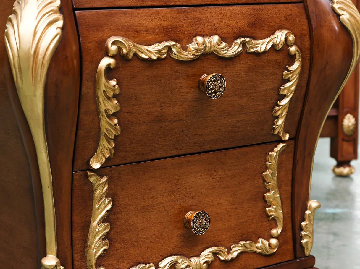 Hand-carved dark wood nightstand with golden decorative accents