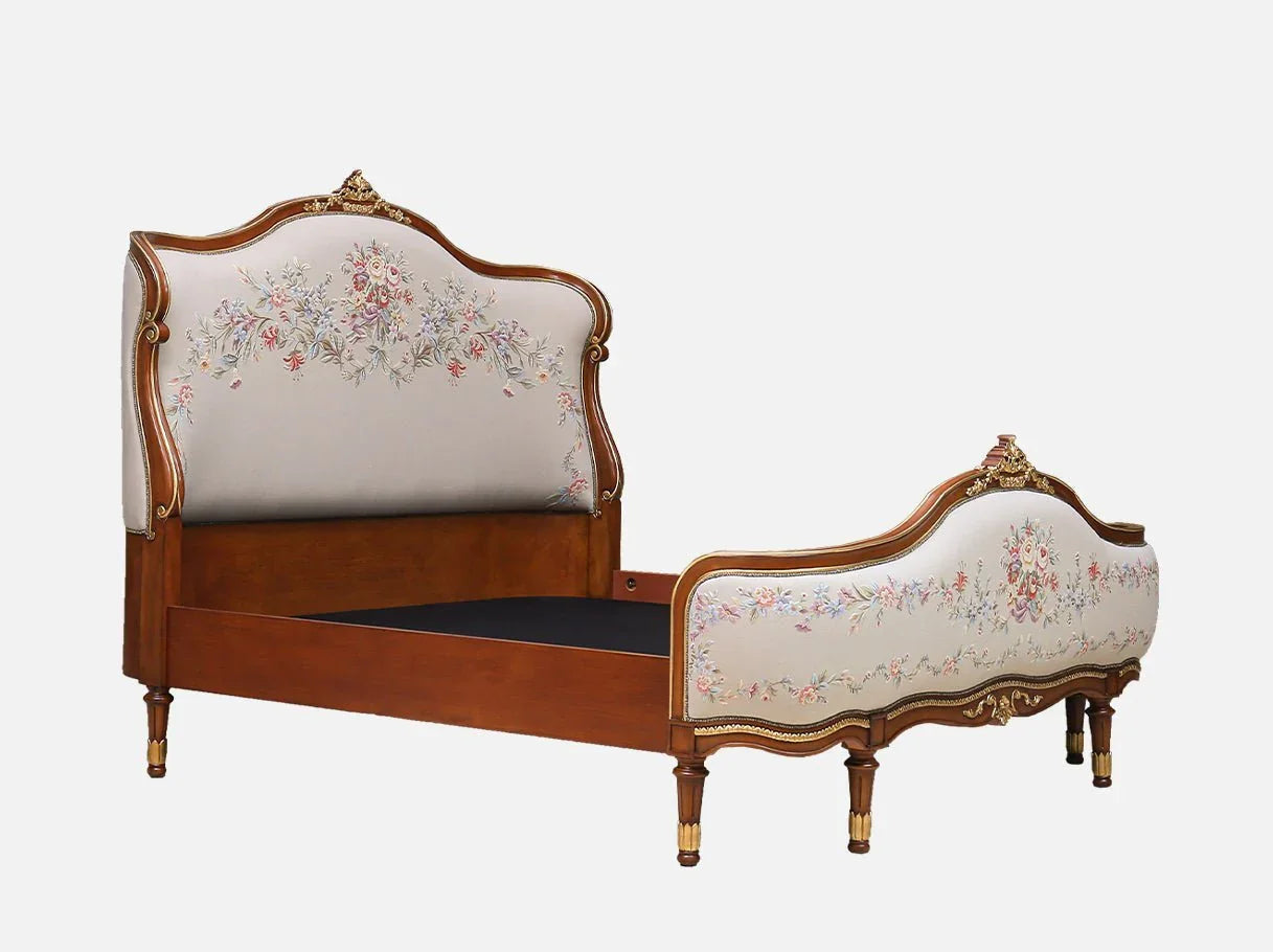 Side angle of B-082 French bed showing arched headboard and gold leaf finish.
