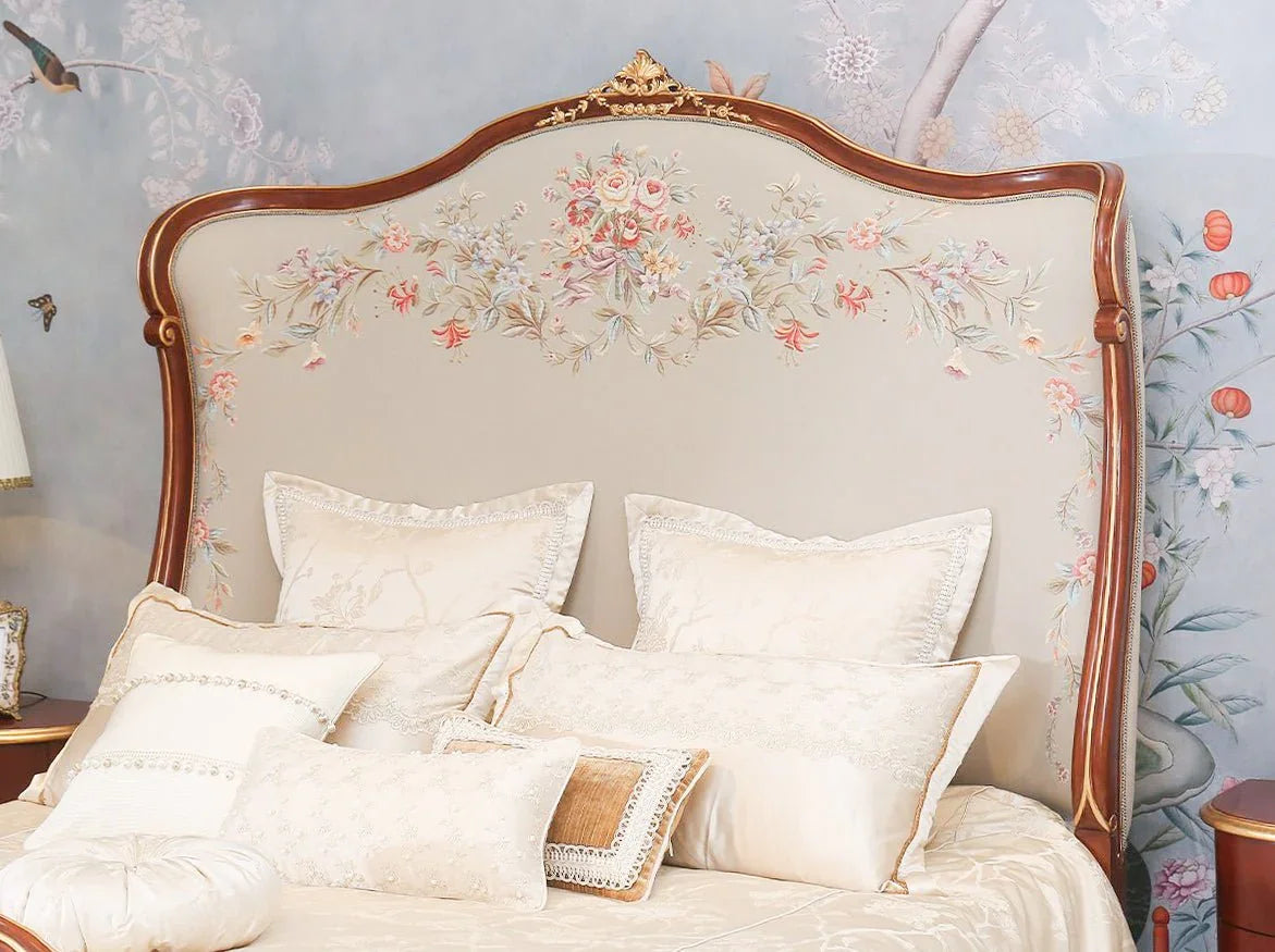 Detail of B-082 upholstered French headboard with gold leaf carving.