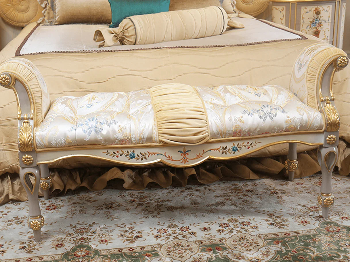 French upholstered bench with gold leaf carving and painted accents for bedroom