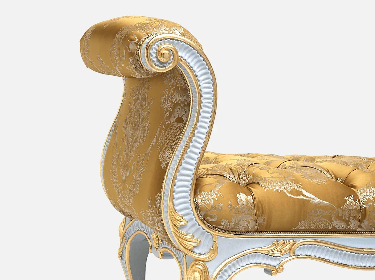 Close-up of carved beechwood frame and gold leaf carving on bedroom bench seat