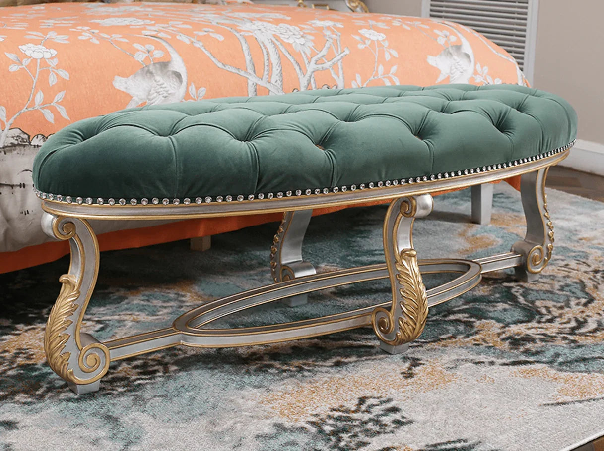 Solid wood bedroom bench with gold leaf finish and plush velvet cushion