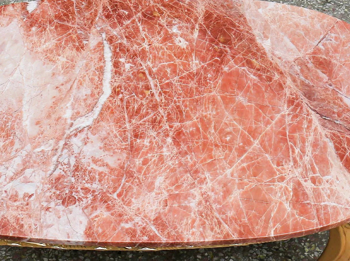 Close-up of red marble tabletop on CT-0020 showing natural veining.