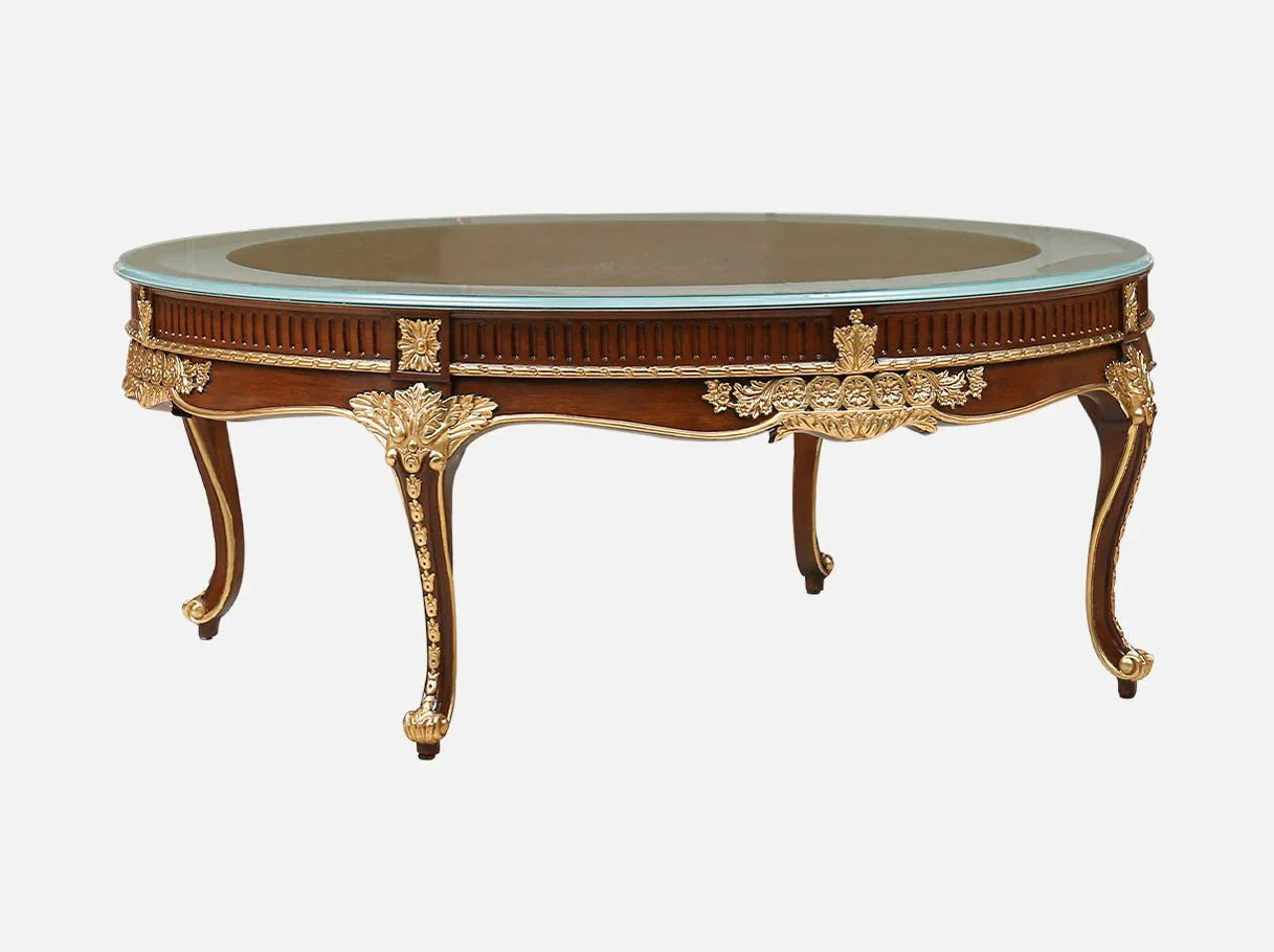 The glass coffee table CT-0506 with carved wood frame and gold leaf accents is a piece of high end furniture for luxury living rooms.