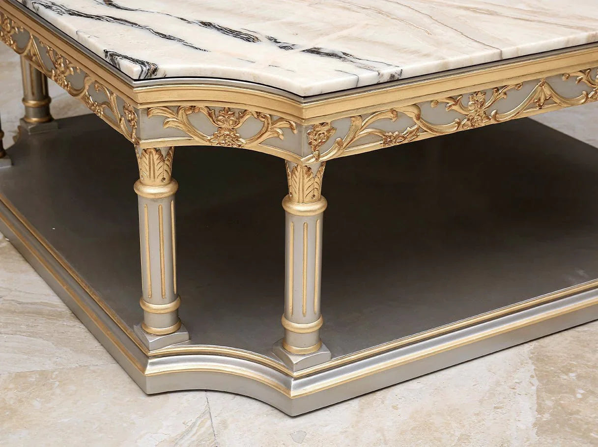 Close-up of CT-0053 marble coffee table base with hand-carved details and gold leaf finish, reflecting high end furniture artistry.