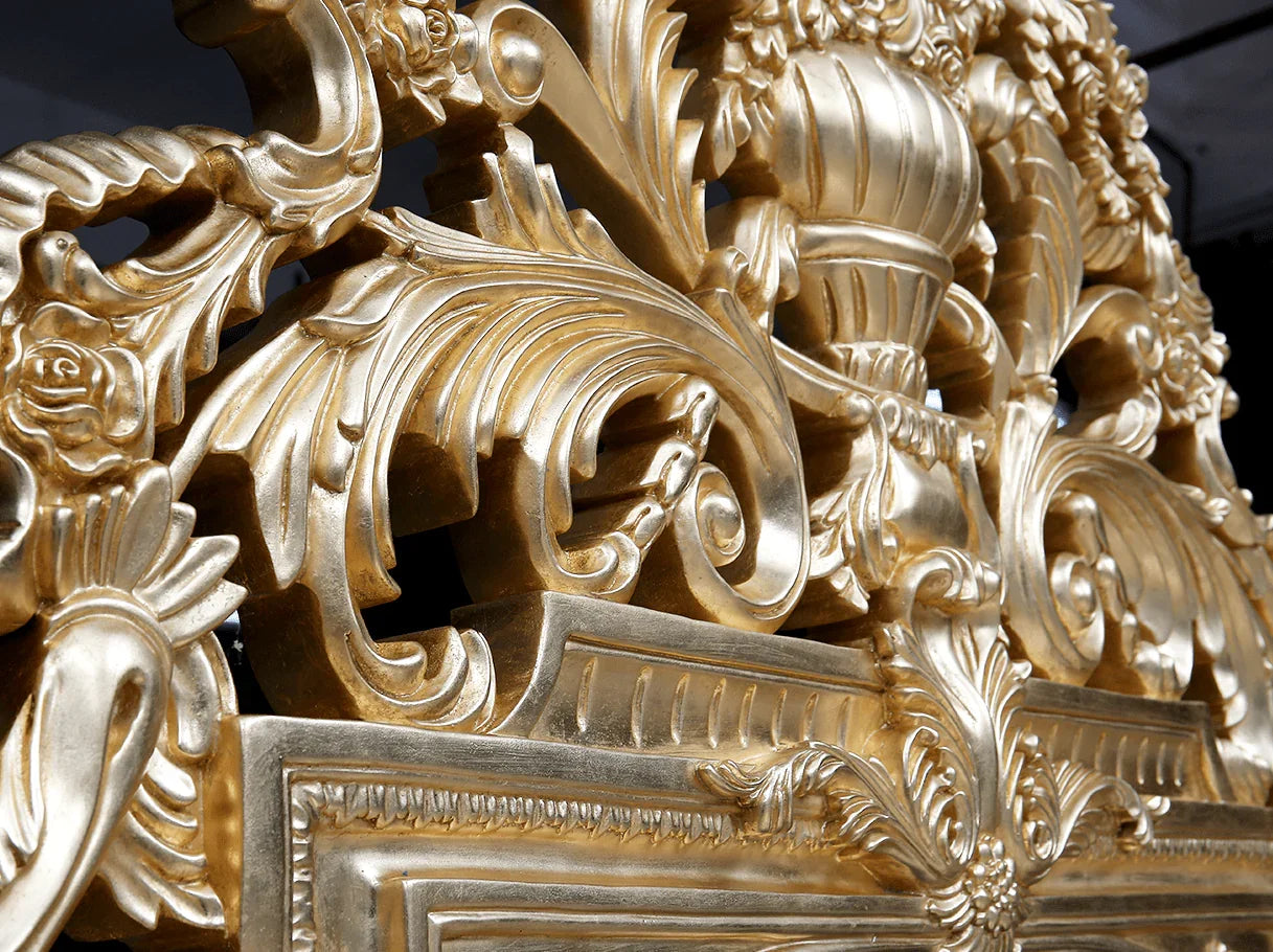 Close-up of gold leaf carving on B-080 French bed, showcasing intricate baroque-style details and artisanal craftsmanship.
