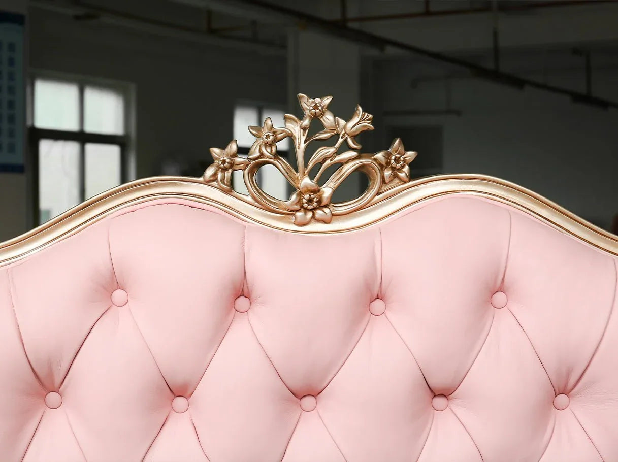 Close-up of B-361 bed headboard crest with tufted leather and carved beechwood detail.