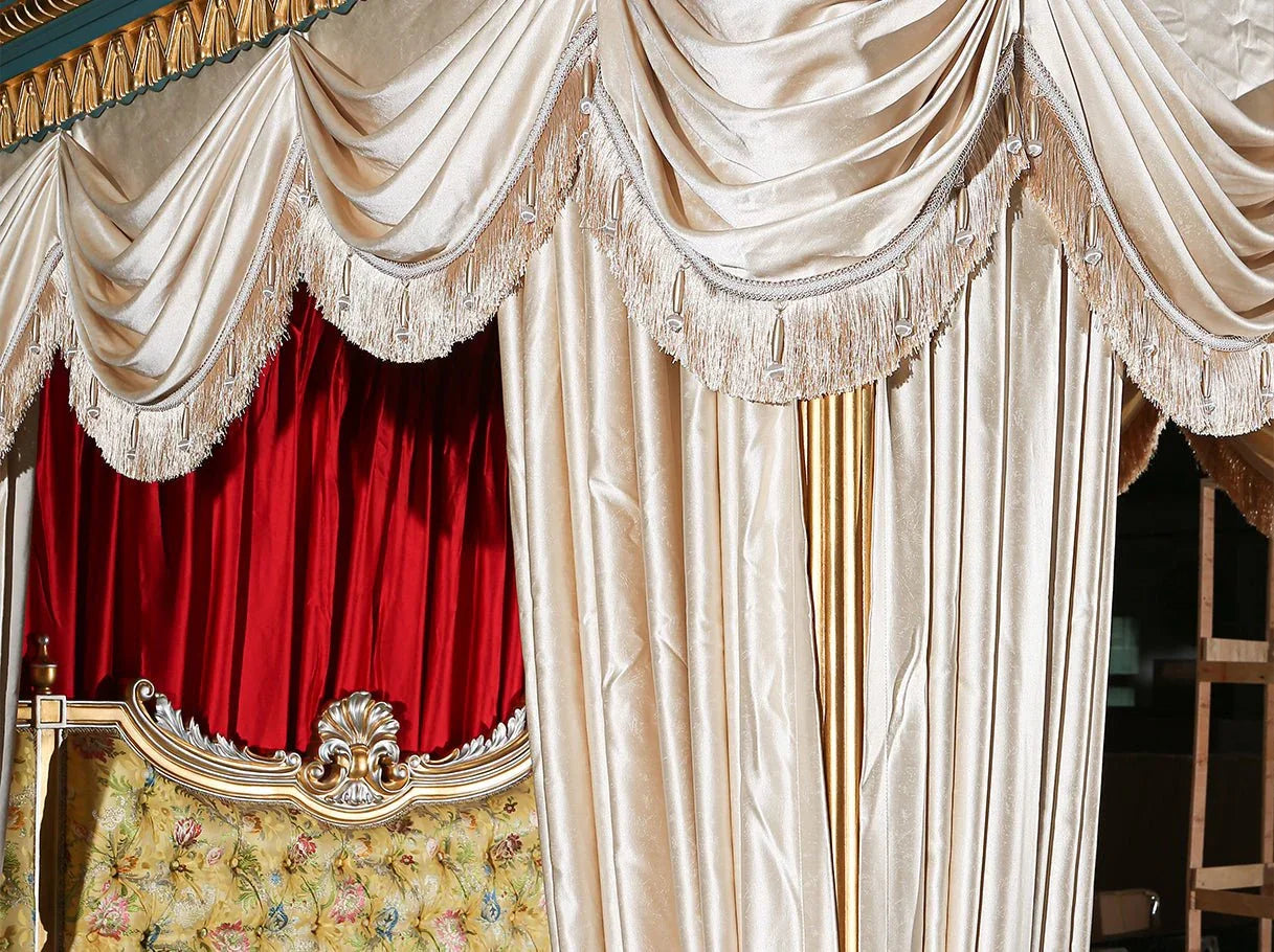 Draped canopy detail of luxury canopy bed B-400 with lustrous layered fabric and ornamental carvings.