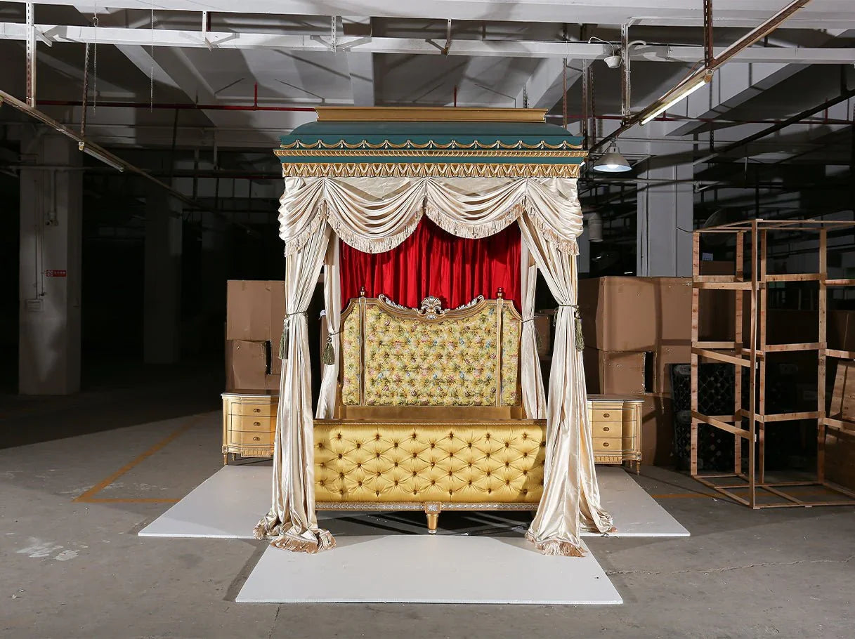 Classical canopy bed B-400 displayed in interior setting, with ornate carving and layered drapery.