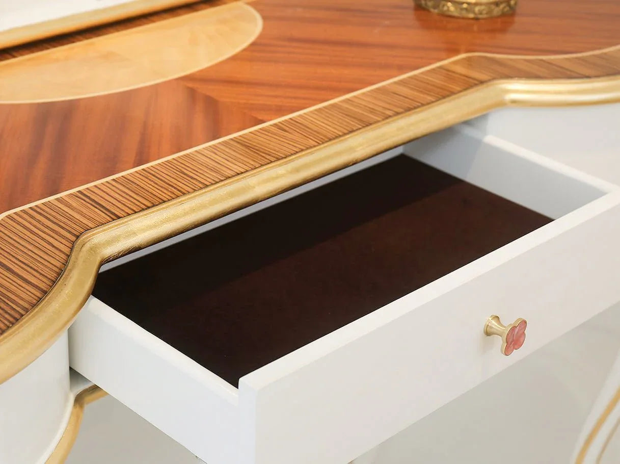 Top surface of vintage wood dresser with smooth wooden finish and decorative carving.