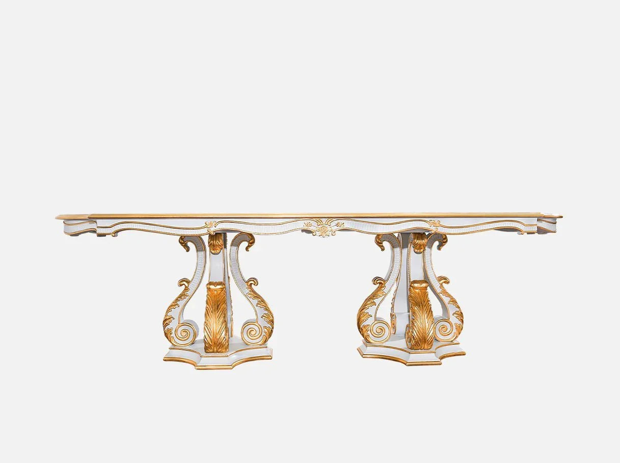 Pedestal dining table D-085 front view: Double pedestal base with carved details, gold leaf accents, wood-veneer tabletop – fits french style dining rooms.