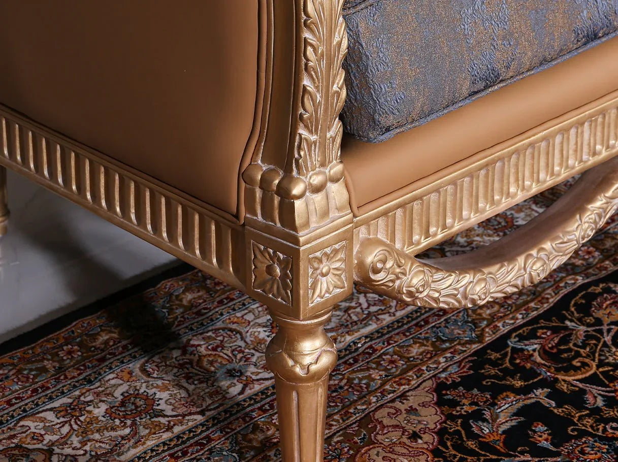 Close-up of French sofa S-1003 leg and frame, highlighting hand-carved beech wood, gold leaf finish, and refined leather edging.