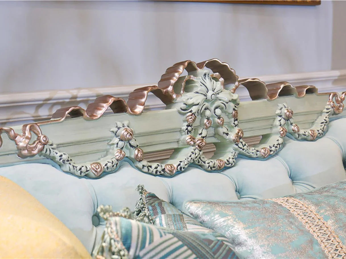 Carved crest detail of French sofa S-1124 with gold & silver leaf accents on beech wood frame.