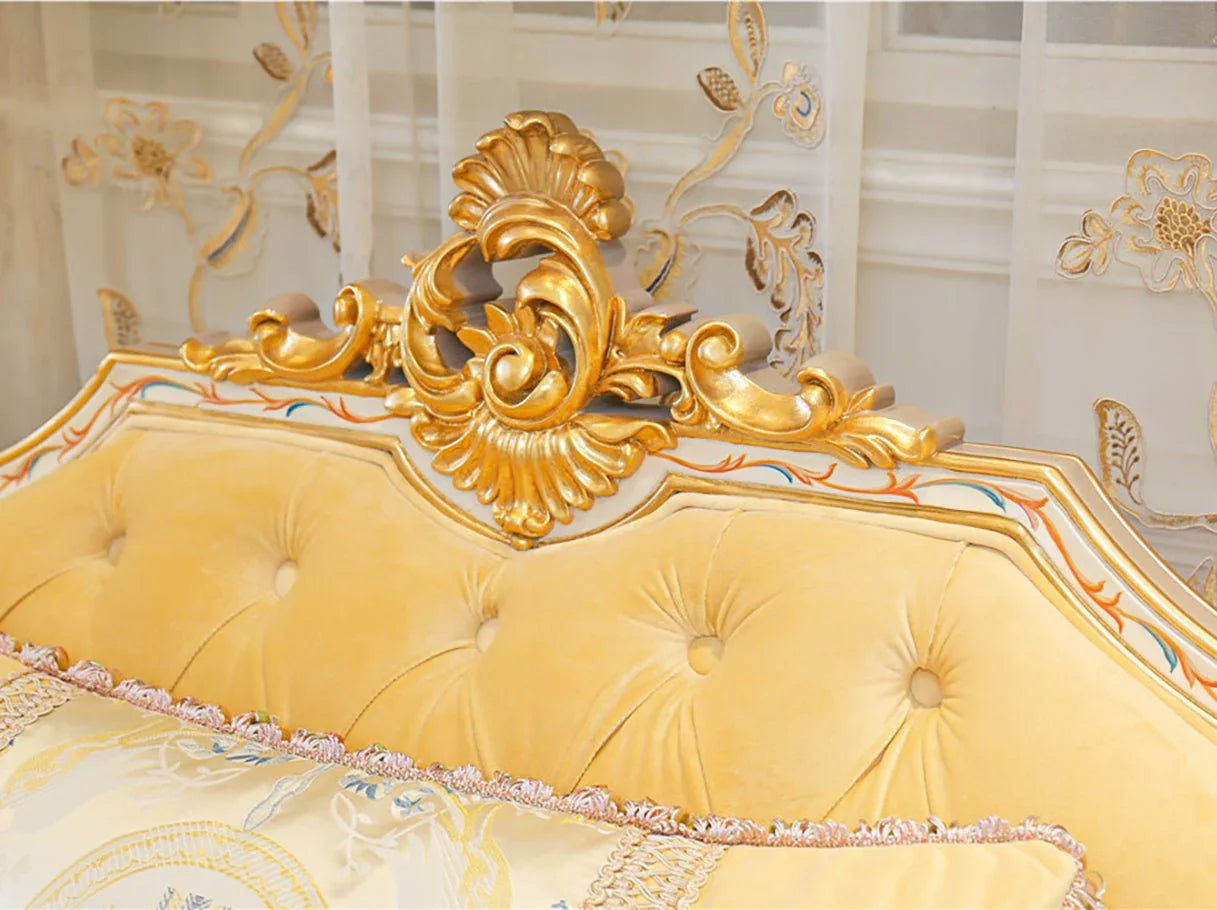 Carved crest detail of French sofa S-1138 with gold leaf and hand-painted accents on beech wood frame.