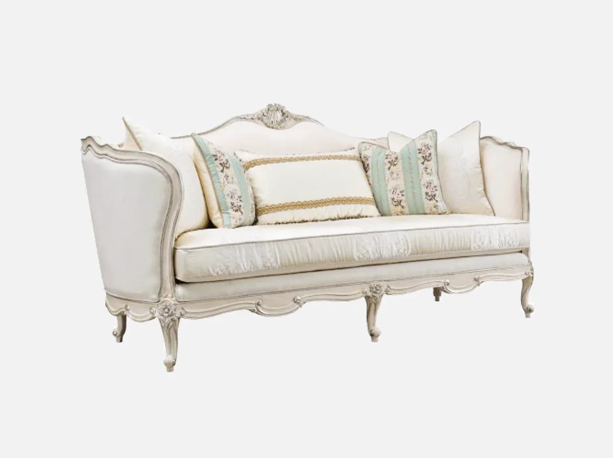Side view of French sofa S-1169 highlighting its sculpted silhouette, plush seat, and elegant silver leaf accents.