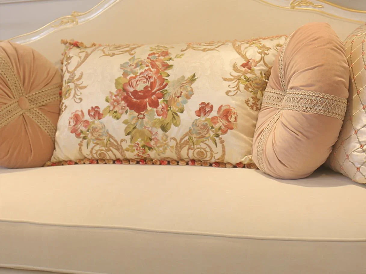 Floral embroidered decorative pillows from a French sofa, combining velvet and satin textures to add elegance and luxury.