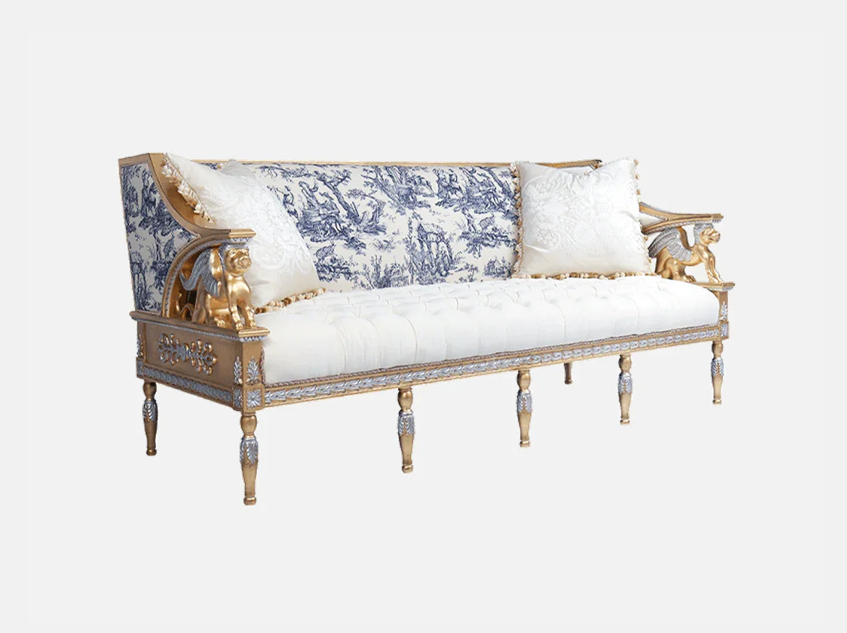Side view of French sofa S-1172 in blue and white toile, showcasing carved beech wood frame with gold leaf accents and turned legs.