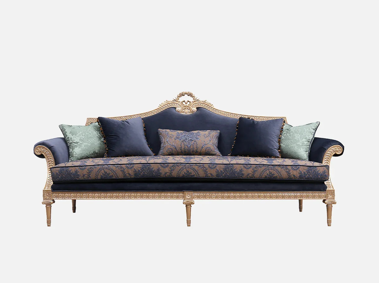 Front view of French sofa S-1178 4-seater in navy and gold, with jacquard cushions, velvet pillows, and hand-carved beech wood frame.