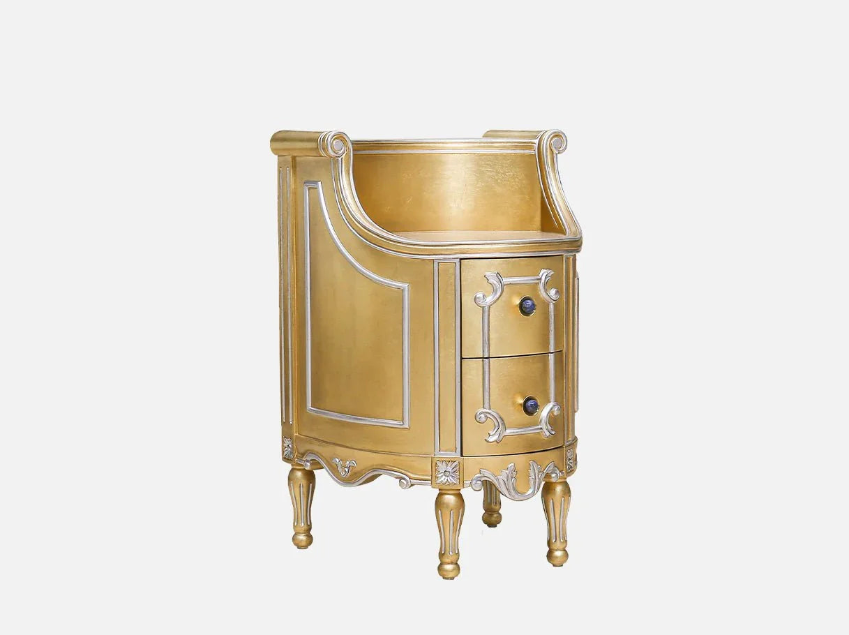 Side view of compact French style gold nightstand with silver accents