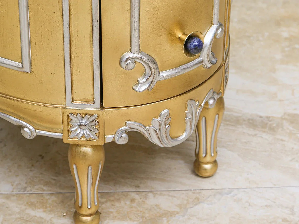 Carved fluted legs and silver highlights on French antique gold nightstand