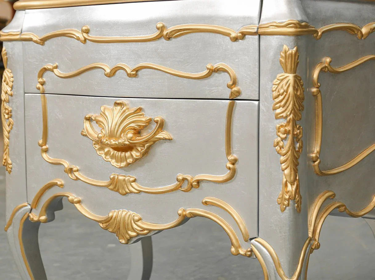 Close-up of luxury bedside table with carved shell-inspired details