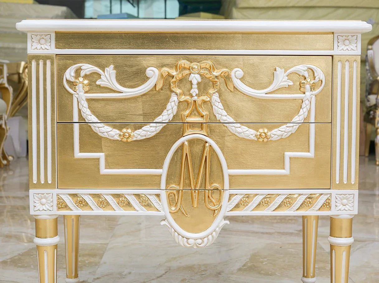 Close-up of drawer motifs on vintage nightstand with neoclassical design