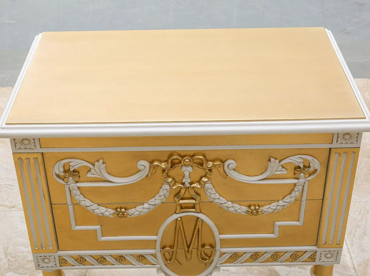 Top view of French gold nightstand with veneered wood surface