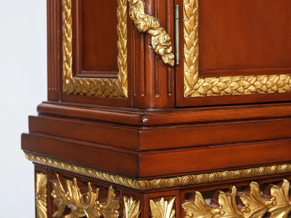 Tall cabinet C-0221 carving detail: Close-up of intricate hand-carved motifs with gold leaf.