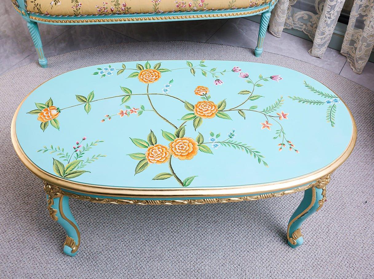 Top view of CT-0020 oval coffee table showing floral hand-painted design.