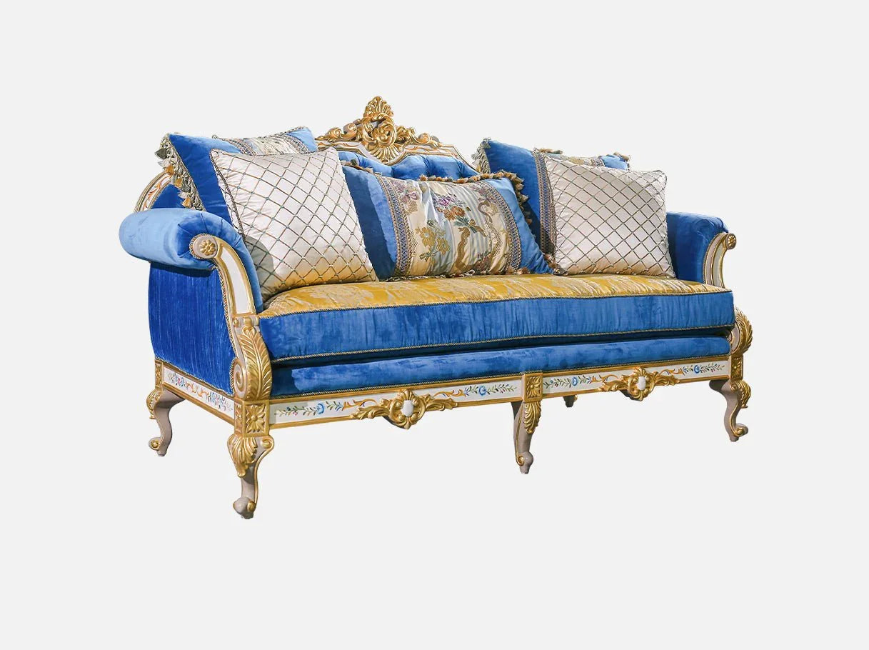 Side angle of French sofa S-1138 showing gilded carved legs, blue velvet upholstery, and floral-painted wooden base.