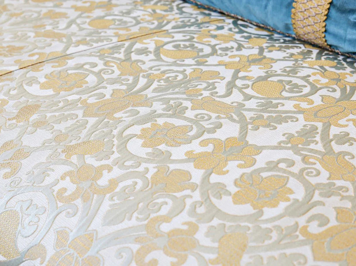 Close-up of the jacquard fabric on French sofa S-1179, showing intricate floral patterns in soft gold and cream for a luxurious touch.