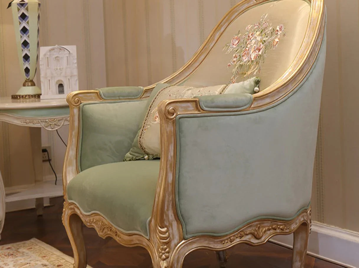 French armchair A-1181 placed in a luxury living room setting, showing floral embroidery and gold accents.