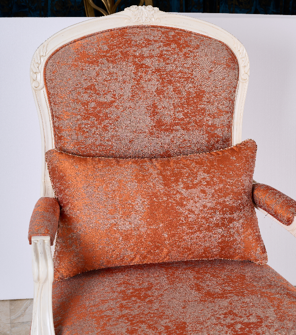 Close-up of AC-003 chair armrest — intricate floral carvings and jacquard fabric texture