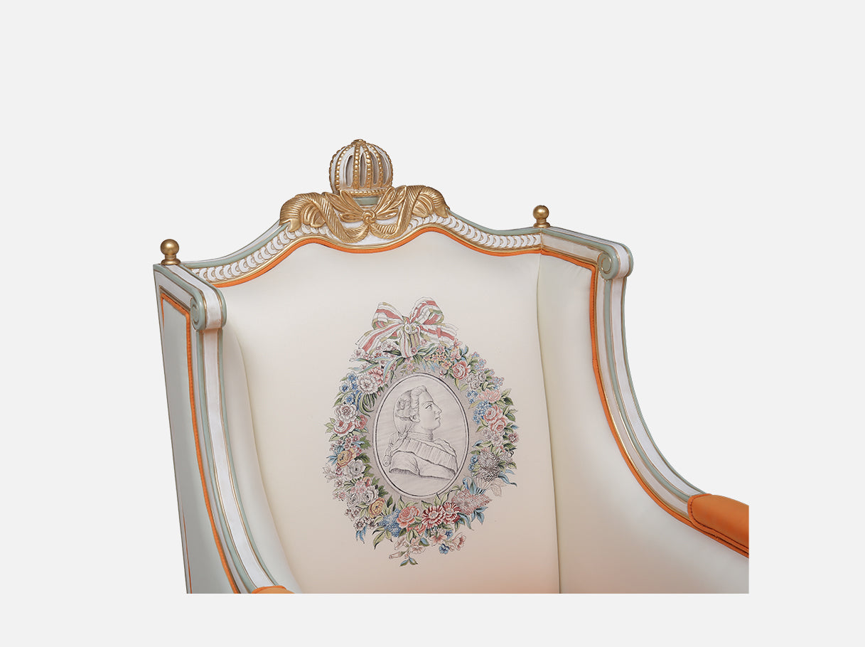 Close-up of A-1183 orange armchair — beech wood carved gold leaf details, hand-painted silk backrest, and French luxury motifs
