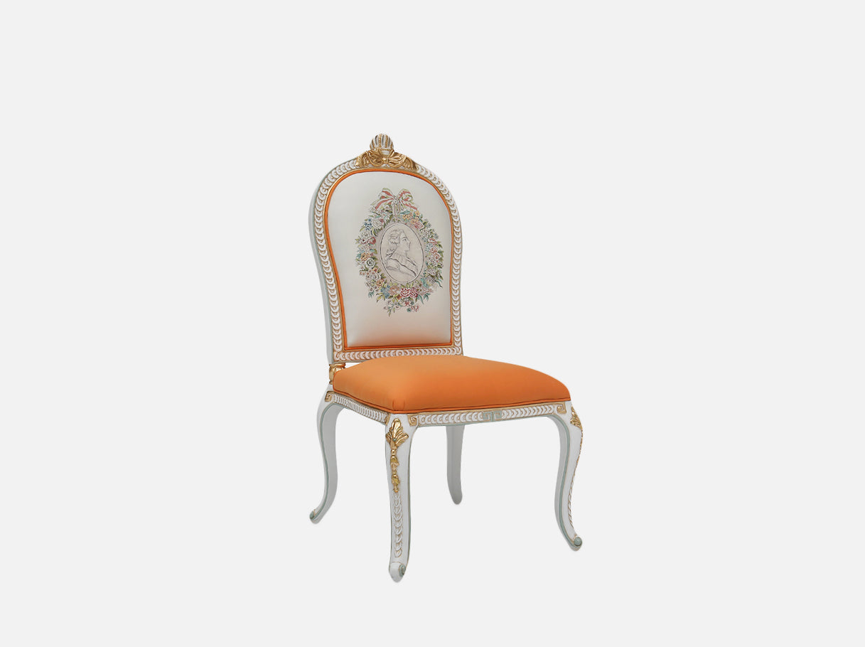 Side view of DC-083-1 orange dining chairs showcasing its hand-carved frame, gold leaf accents, and orange silk seat