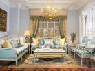 French sofa S-1124 styled in a luxury French living room set with coordinated armchairs, coffee table, and chandelier.