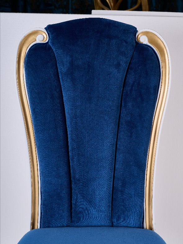 Close-up of DC-073 chair backrest — vertical tufted design and gold leaf edge trim