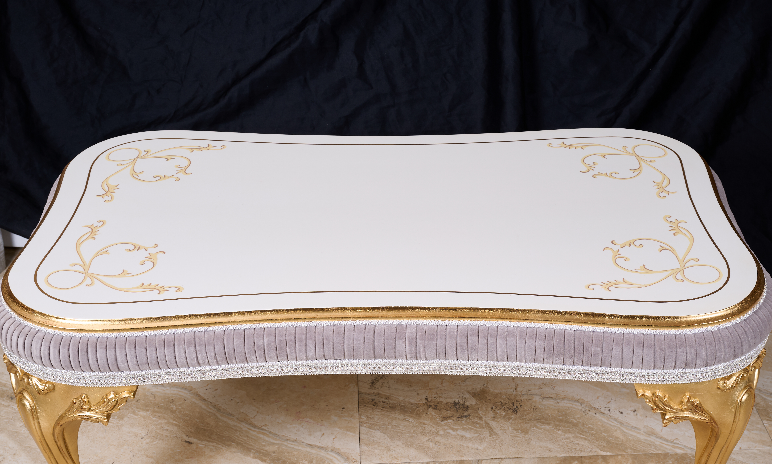 Close-up of CT-725 tabletop — hand-painted gold scroll patterns and gold leaf edge trim